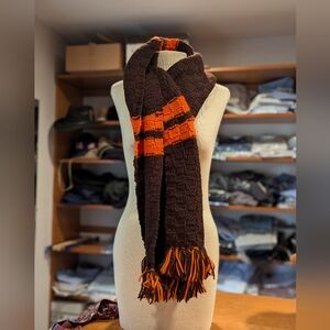 83"x 11" hand knit orange and brown Hathaway scarf with fringes.